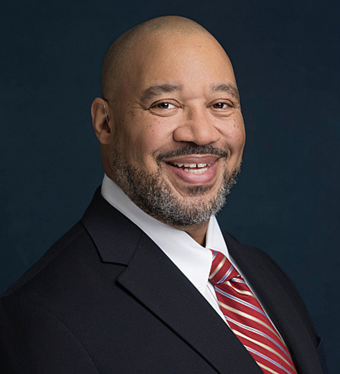 Arrick Jackson smiles at the camera. Jackson will begin serving as chancellor of Indiana University Northwest on July 1. Photo by Stacy Kennedy Photography